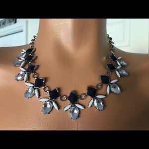 Beautiful silver tone necklace with stones.